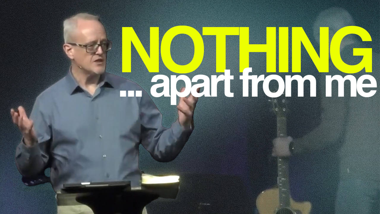 Tim Geiger on stage next to the words Nothing... Apart form me.